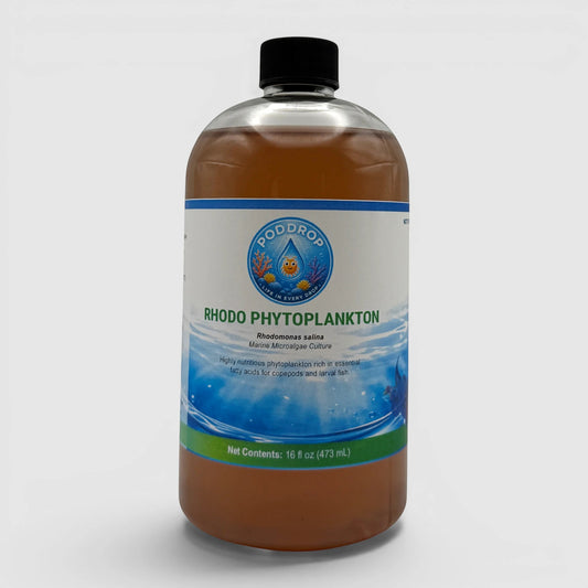 PodDrop Rhodomonas salina phytoplankton culture, a red-pink liquid in a clear bottle, rich in DHA+EPA for coral coloration and nutrition.
