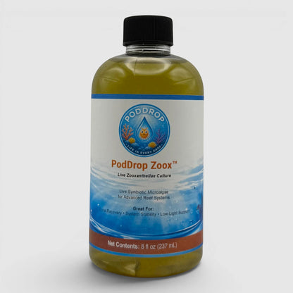 PodDrop ZooX live zooxanthellae culture in a clear bottle with a black cap. Supports coral coloration and recovery.